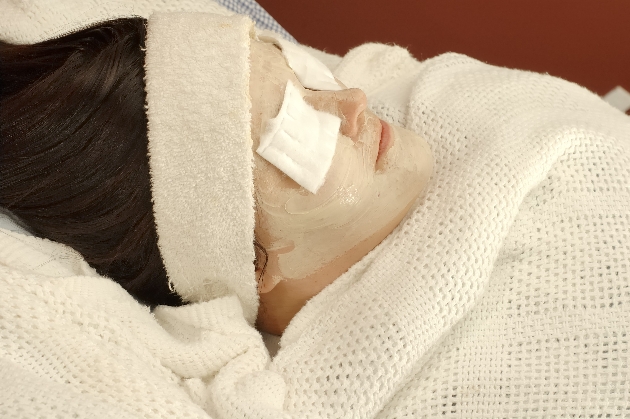 woman wrapped up in towels having spa treatment 