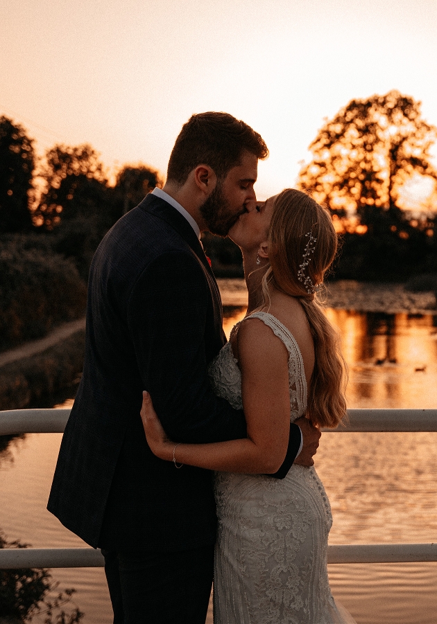 Couple kiss at sunset