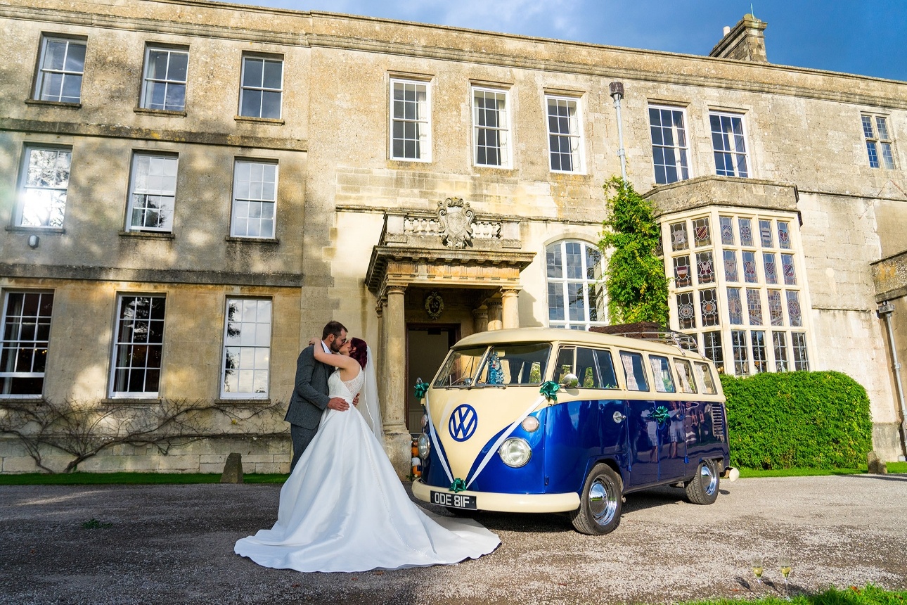 Couple with campervan in front of venue