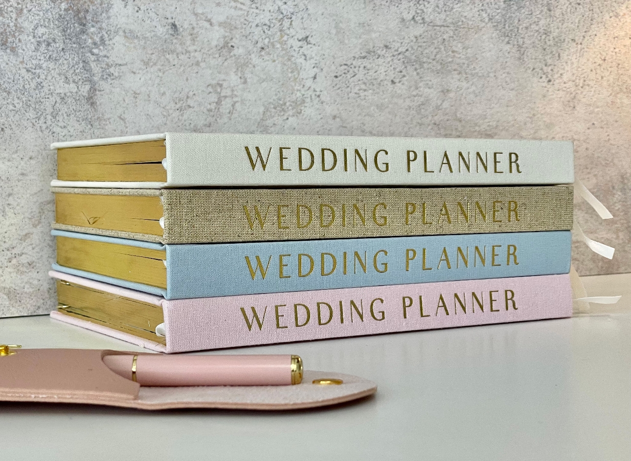 New Wedding Planners in four colours piled up
