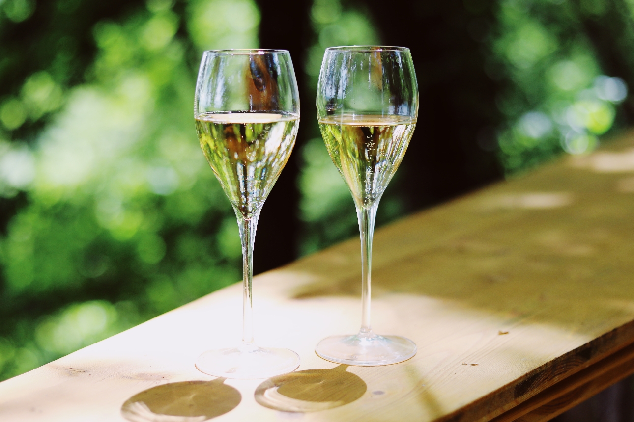 two glass of champagne on a wooden shelf