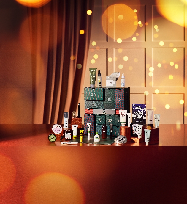 An advent calendar surrounded by beauty products