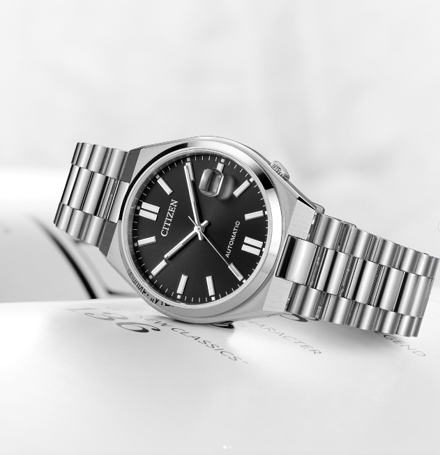 A silver watch with a black face