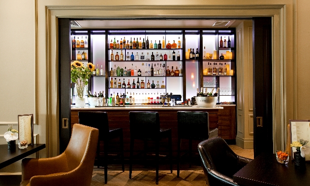 A dining room with a wall of drinks